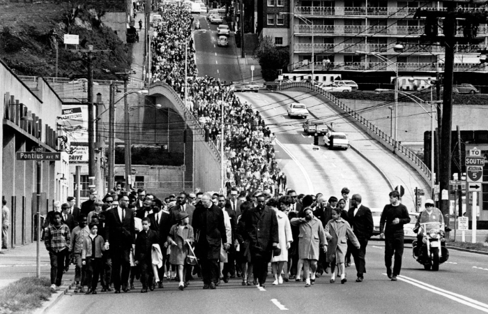 On April 7, 1968, Seattle mourners march down Denny Way from Capitol Hill to a memorial service at Seattle Center three days after the assassination of the Rev. Dr. Martin Luther King Jr. (Bruce McKim, The Seattle Times)