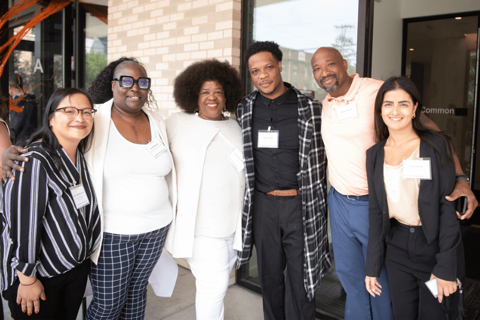 A photo of Patricia Hayden standing with other YWCA staff members.