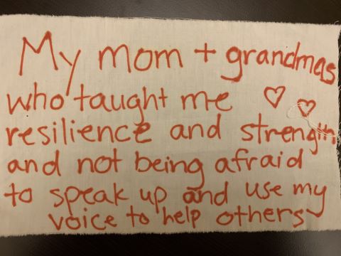 Picture of tapestry contribution that says: "My mother and grandmothers... all such different stories leading to totally different paths... together they make up a huge part of the woman I've become."