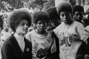 Oakland, California: Kathleen Cleaver, Communications Secretary and first female member of the Party’s decision-making Central Committee, talks with Black Panthers from Los Angeles who came to the “Free Huey” rally in DeFremery Park (named by the Panthers Bobby Hutton Park) in West Oakland, July 28, 1968. Stephen Shames (American, born in 1947) Photograph, archival pigment print, * Gift of Lizbeth and George Krupp * © 2023, Stephen Shames * Courtesy Museum of Fine Arts, Boston